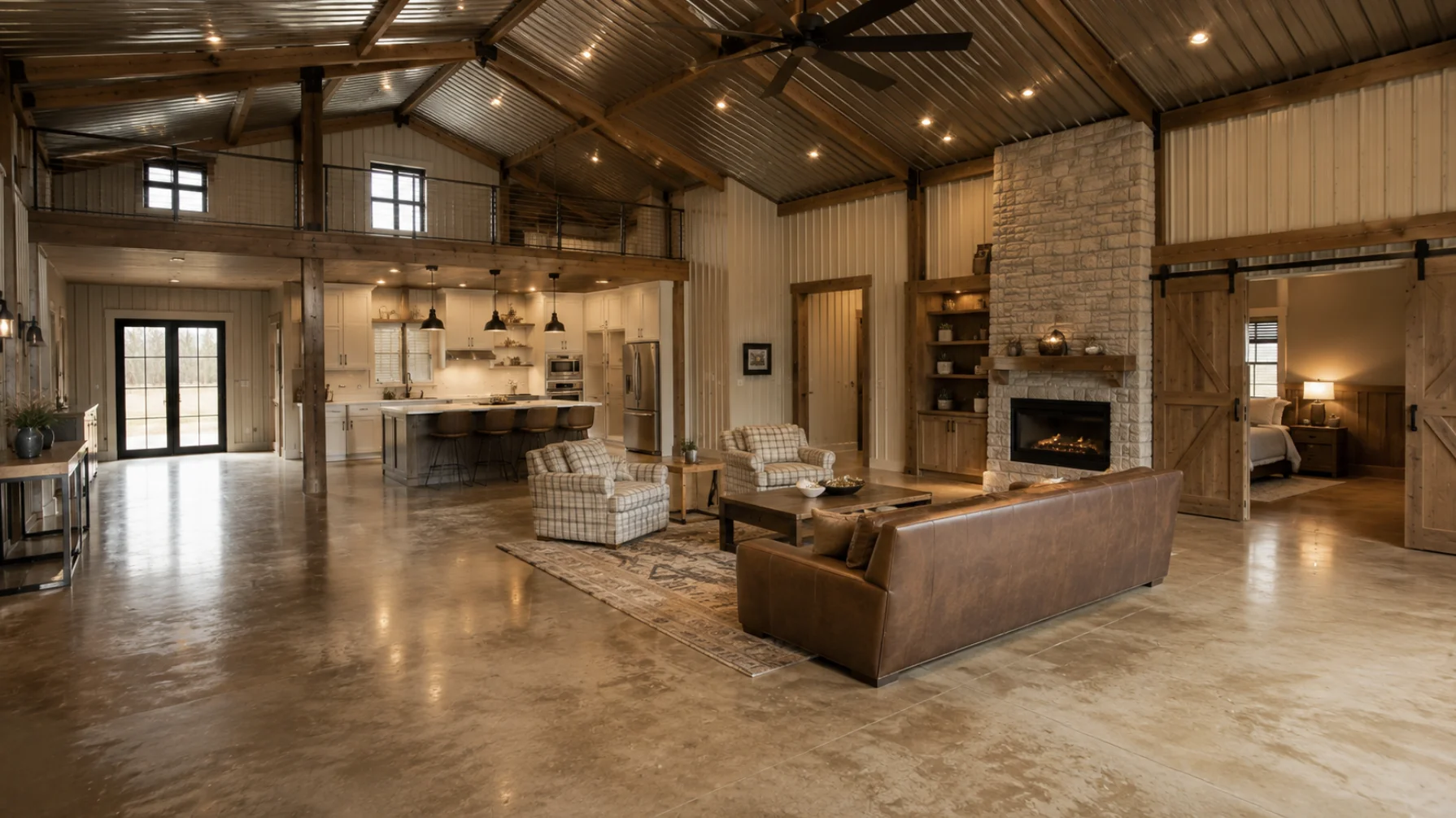 Custom barndominium interior finish-out featuring an open-concept living room, gourmet kitchen, stone fireplace, exposed timber beams, and premium finishes.